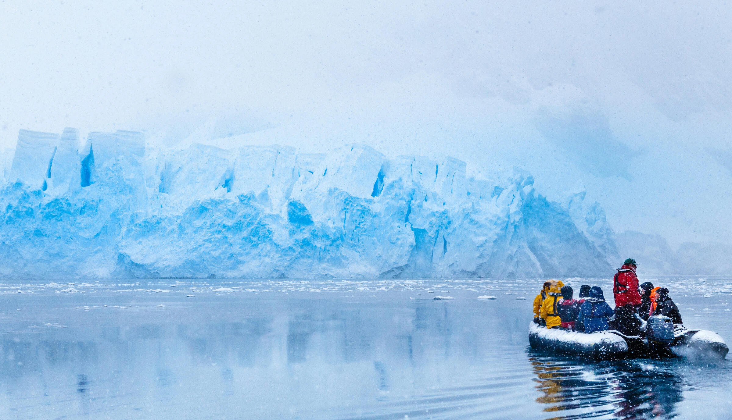 Zodiac beneath a polar glacier