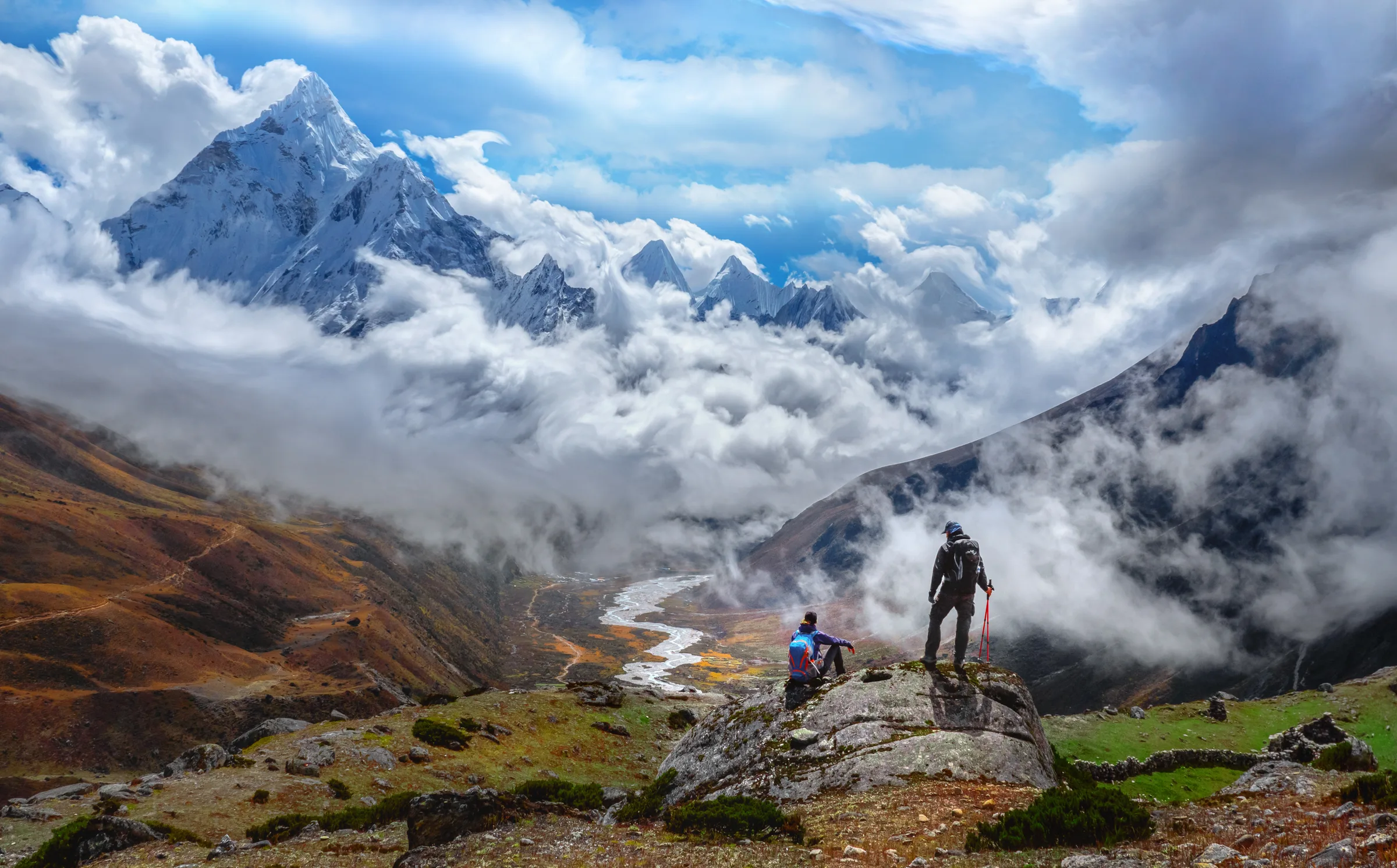 Trekkers above the Everest Base Camp valley with Ama Dablam behind