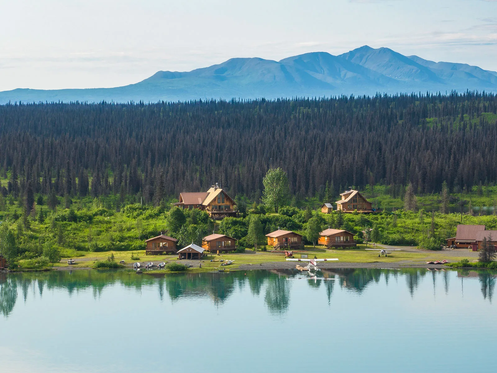 Chelatna Lake Lodge cabins and floatplane on the lakeshore